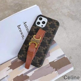 Puzdro na iPhone Celine Triomphe z pláteného silikónu s remienkom na zápästie v čiernej farbe